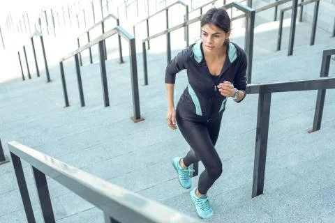 Young woman active exercise workout on street outdoor Stock Photos
