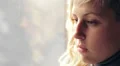 A young woman answers the phone HD Footage