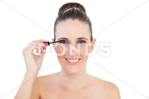 Young woman applying mascara Stock Photos