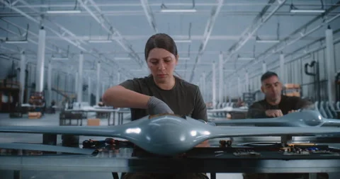 Young Woman Assembling Drone on Modern Production Line in High Tech Factory Video stock 345061299