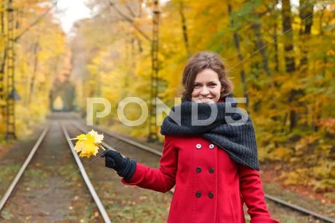 Young woman in autumn park Stock Photos