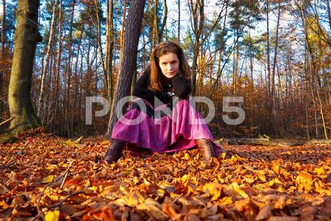 Young woman in autumn park Stock Photos