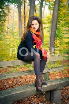 Young woman in autumn park Stock Photos