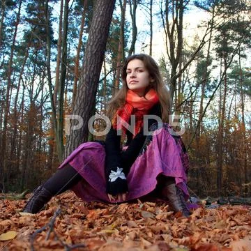 Young woman in autumn park Stock Photos