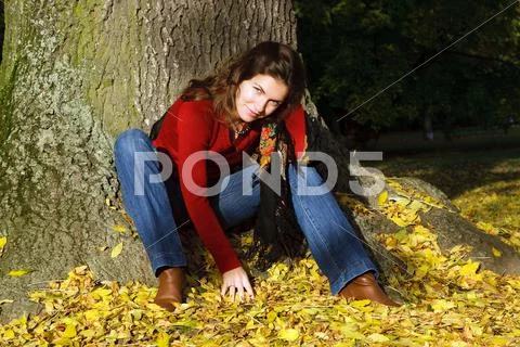 Young woman in autumn park Stock Photos