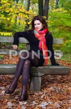 Young woman in autumn park Stock Photos