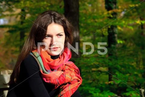 Young woman in autumn park Stock Photos