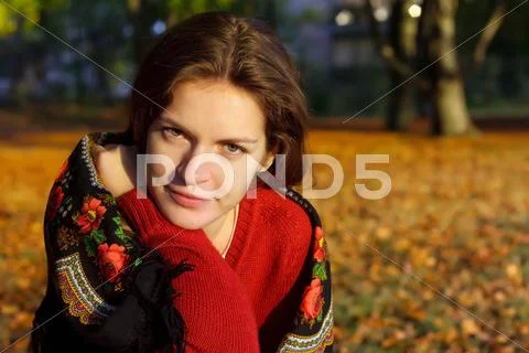Young woman in autumn park Stock Photos