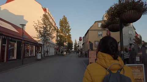 Young woman backpacker walking through Reykjavik, Iceland Downtown  Stock Footage 116090209