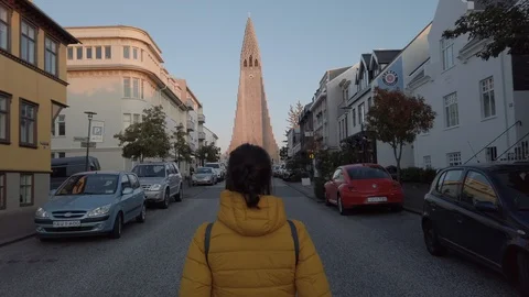Young woman backpacker walking through Reykjavik, Iceland Downtown  Stock Footage 116091987