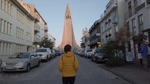 Young woman backpacker walking through Reykjavik, Iceland Downtown  Stock Footage 116092306