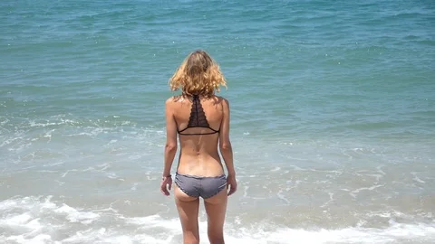 Young woman on the beach Stock Footage 92553404