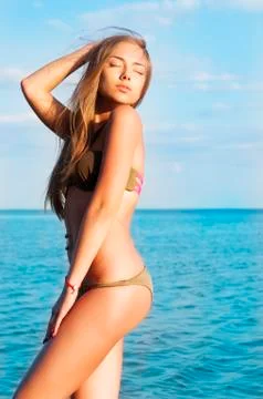 Young woman on the beach. Stock Photos