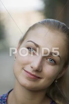 A young woman with beautiful blue eyes, close-up Stock Photos