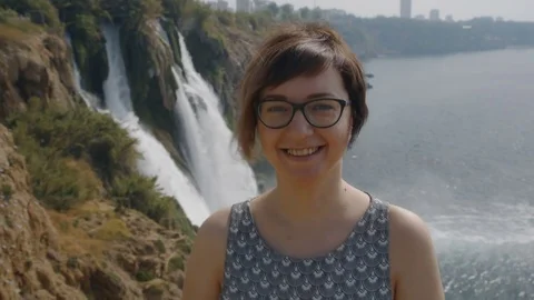 Young woman is being happy near the sea Stock Footage