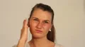 Young woman with blocked ear. HD Footage