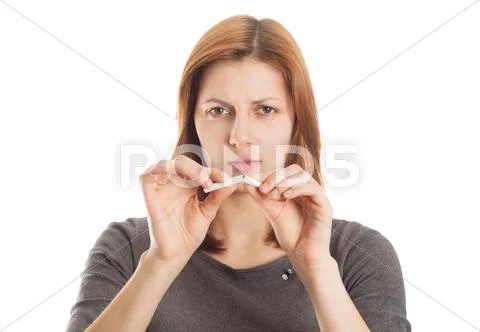 Young woman breaking a cigarette in disgust Stock Photos