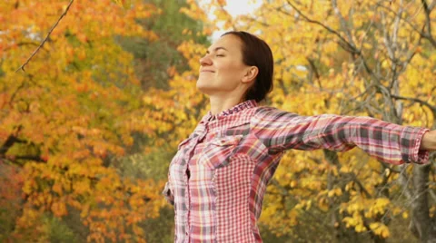 Young woman breathing in autumn park HD Stock Footage