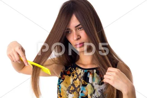 Young woman brushing her long hair Stock Photos