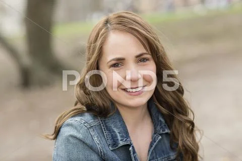 A young woman in central park. Stock Photos