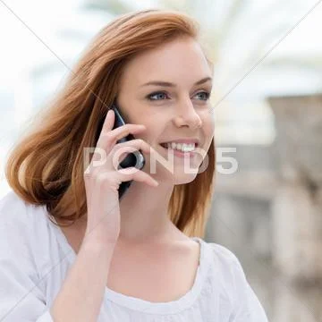Young woman chatting on her mobile Stock Photos