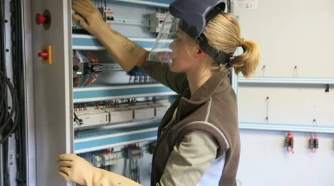 Young woman checking electrical system of heating room Stock Footage 51575032