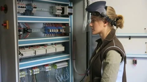 Young woman checking electrical system of heating room Stock Footage 51575670