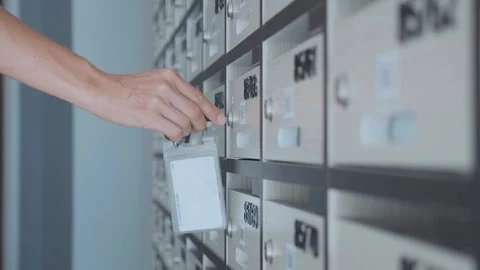 Young woman checking mailbox at condo, indoor Stock Footage 90056482