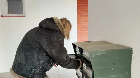 Young Woman Checking Mailbox in her house Stock Footage 297849050