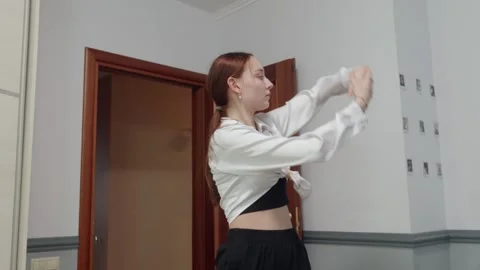 Young woman clapping while dancing at home, modern lifestyle concept Stock Footage 329210471