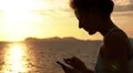 Young Woman Close-up Reads Message in Mobile Phone and Smiling. Slow Motion. HD Footage
