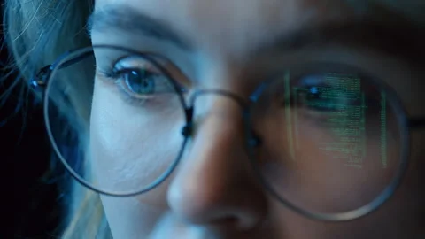 Young Woman with Coding Reflection in Glasses 스톡 동영상 244223328