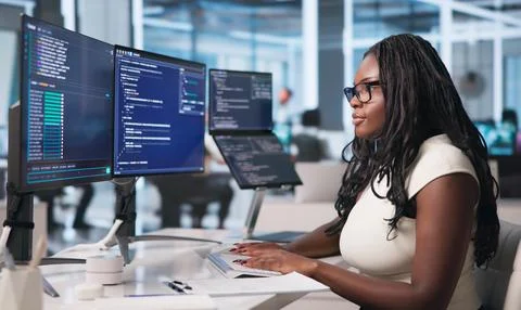 Young Woman Coding Software Project Remotely Using Laptop And Cloud Tools. Stock Photos