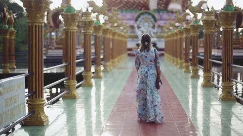 Young woman coming in temple complex Wat Plai Laem on Koh Samui, 1920x1080 Stock Footage