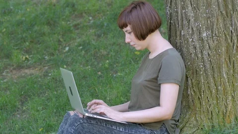 Young woman with computer Stock Footage 114578034