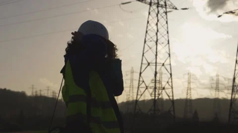 Young Woman Constructor worker with curly hair put his helmet. Slow motion fo Stock Footage 149487557
