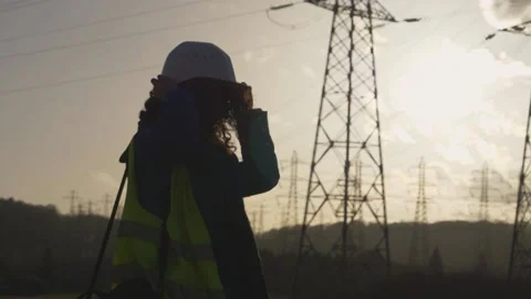 Young Woman Constructor worker with curly hair put his helmet. Slow motion fo Stock Footage 149487564