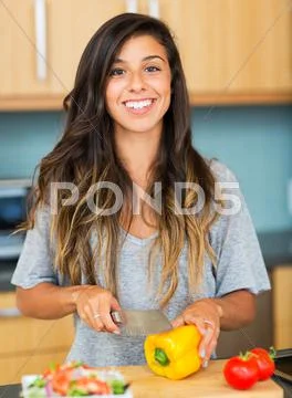 Young woman cooking. healthy food Stock Photos