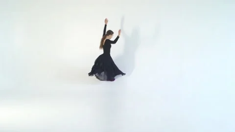 Young woman dancer dancing on white isolated background. White background, black Stock Footage 85771099