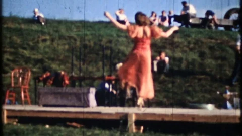 Young woman dances on outdoor stage  1950s vintage home movie  4090 Stock Footage