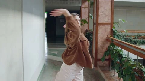 Young Woman Dancing and Walking On Camera Stock Footage 166345322