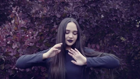 A young woman is dancing in front of the camera Stock Footage 74804093