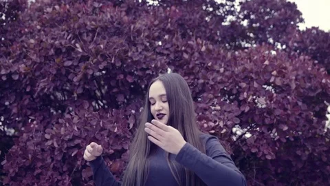 A young woman is dancing in front of the camera Stock Footage 74805552
