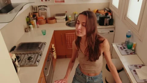 Young Woman Dancing in Her Kitchen Stock Footage 333698088