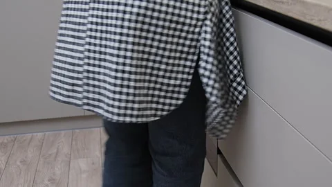 A young woman dancing in the kitchen. Stock Footage 266420239