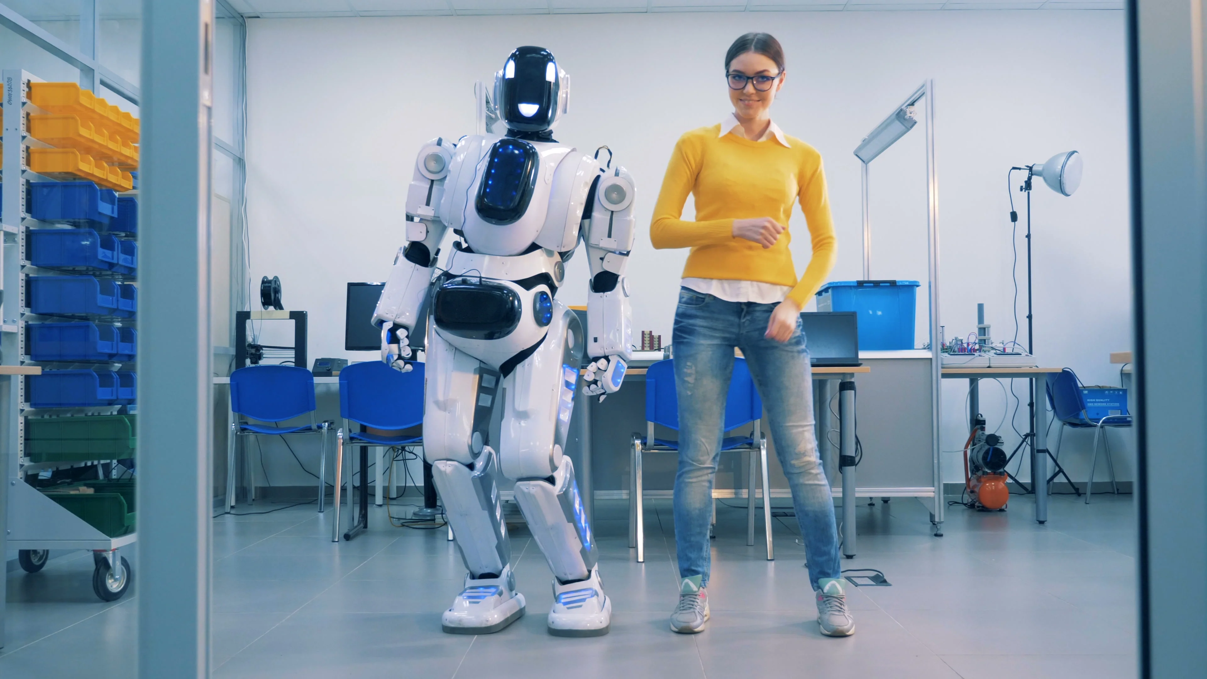Young woman is dancing with a robot who , Stock Video