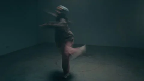 Young Woman Dancing under Strobing Lights with Motion Blur Stock Footage 335681572