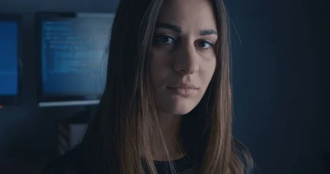 Young Woman Developer Programmer looking at camera at binary code background Stock Footage 102216412