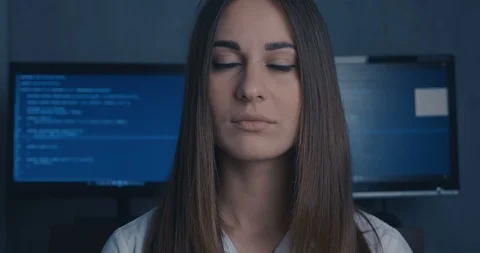 Young Woman Developer Programmer looking at camera at binary code background. 4k Stock Footage 104278532