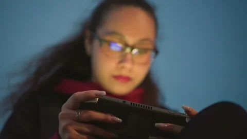 Young Woman Developer Testing Mobile App Interface On Handheld At Night With Stock Footage 330803921